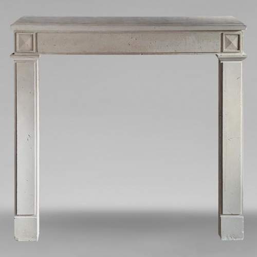 Louis XVI style stone mantel with diamond carved heads