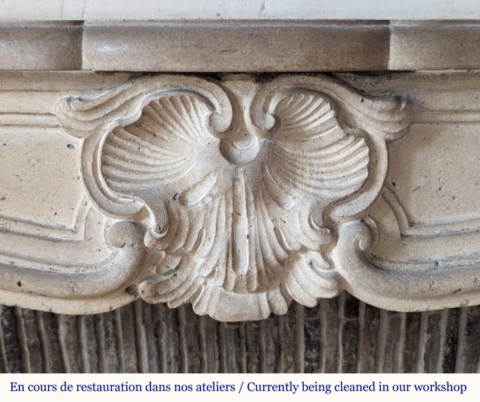Louis XV period carved stone mantel with shell, 18th century - Stone