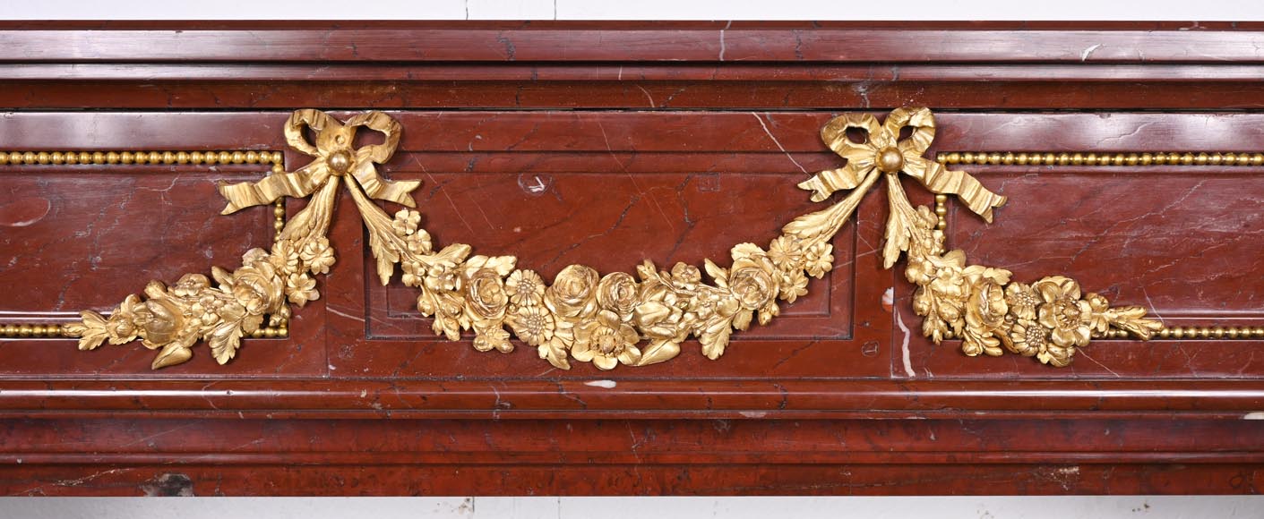 Louis XVI style fireplace in Antique Red marble, with bronze mounts, decorated with a garland Louis XVI style fireplace in Antique Red marble, with bronze mounts, decorated with a garland-1