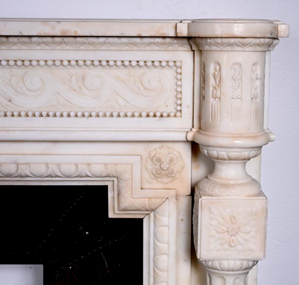 Louis XVI style white marble fireplace with rounded columns and female profile medallion-11