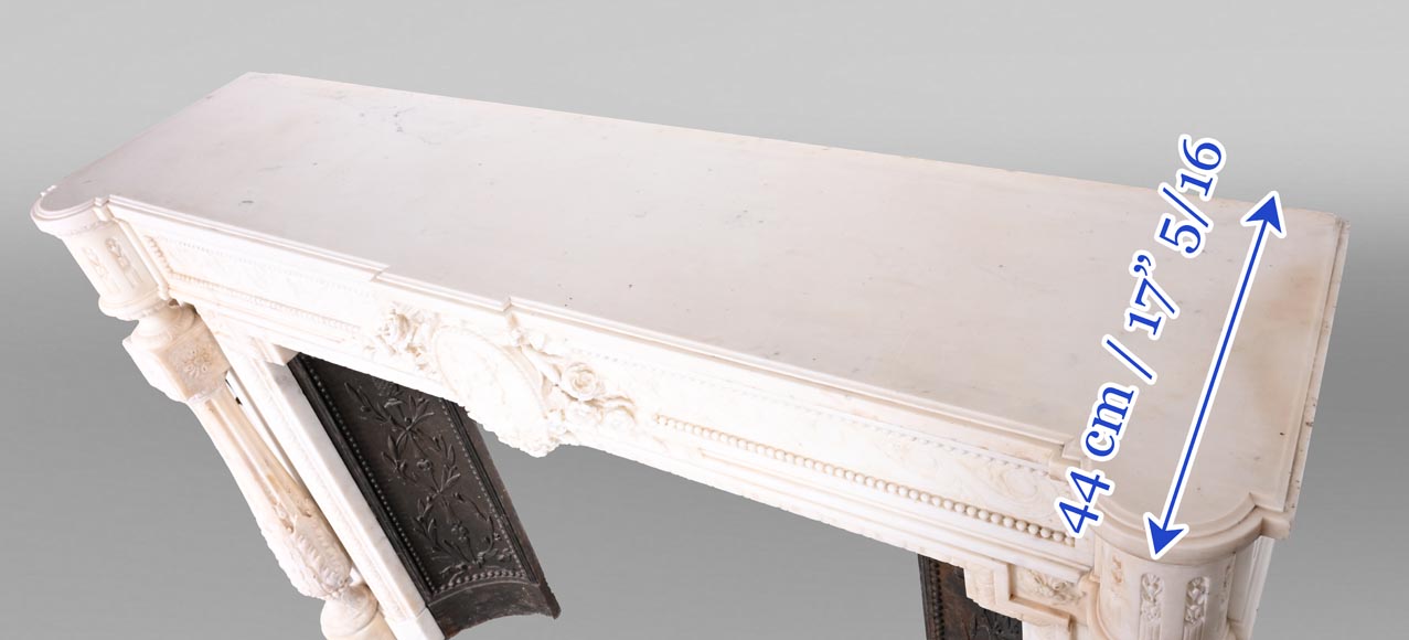 Louis XVI style white marble fireplace with rounded columns and female profile medallion-13