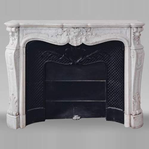 Louis XV style fireplace in Carrara marble decorated with a shell