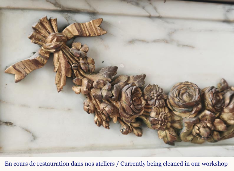 Louis XVI style fireplace in Arabescato marble decorated with a garland of gilded bronze flowers-2
