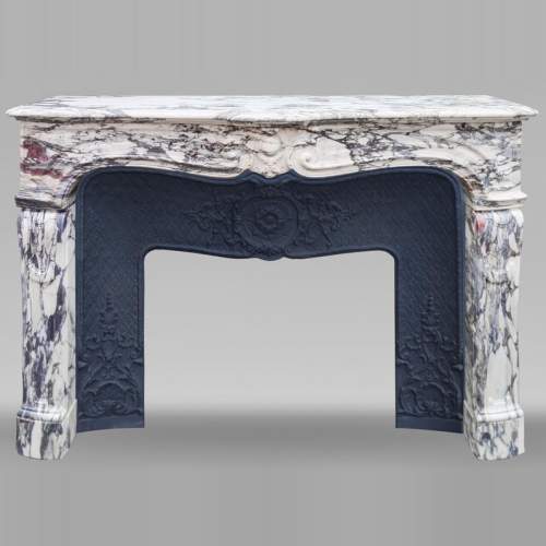 Louis XV style fireplace in Violet Breccia, with a central cartouche framed by palmettes
