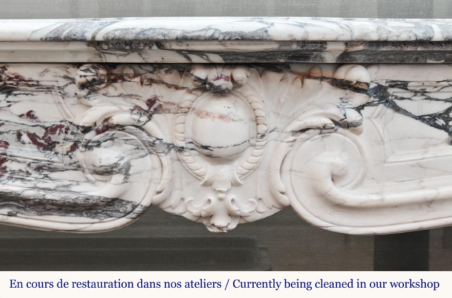 Louis XV style fireplace in Violet Breccia, with a central cartouche framed by palmettes-1