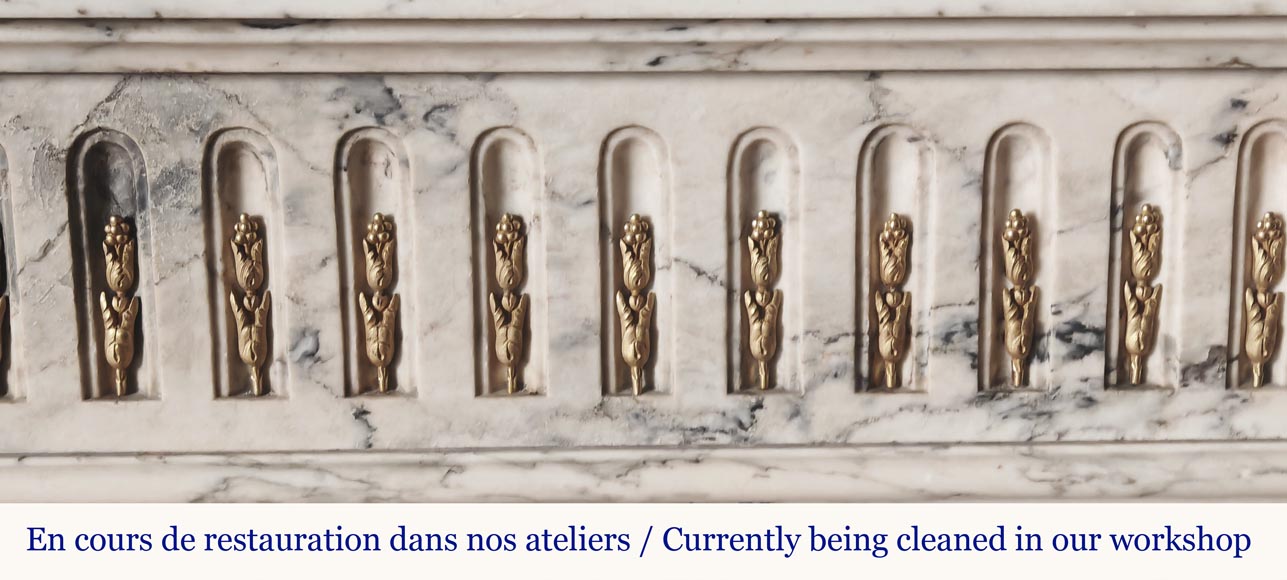 Curved Louis XVI style fireplace in veined marble, with bronze asparagus decoration-1
