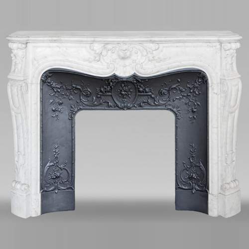 Louis XV style fireplace in Carrara marble, with plant decoration