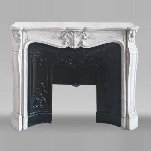 Louis XV style fireplace in Carrara marble decorated with a palmette