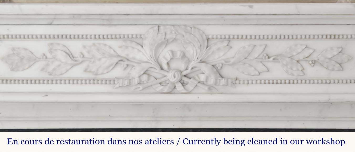 Curved Louis XVI style fireplace with beaded decoration, in semi-statuary marble.-1