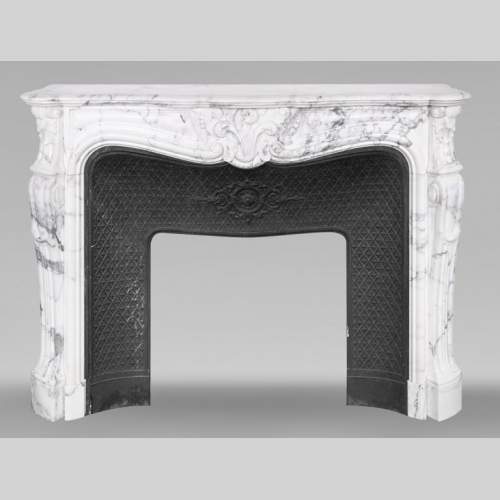Louis XV style fireplace in Arabescato marble, decorated with an asymmetrical palmette