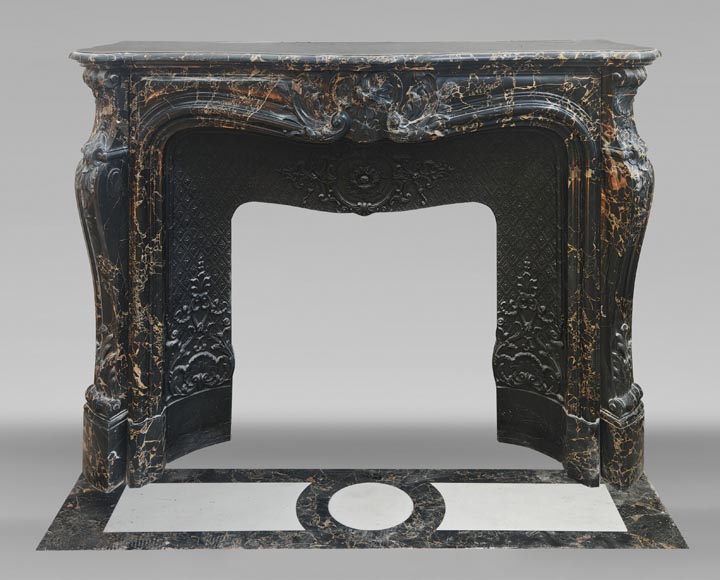 Louis XV style fireplace in richly sculpted Portoro marble-0