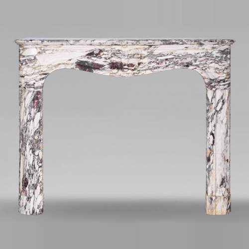 Regency style fireplace decorated with a palmette, in purple breccia marble