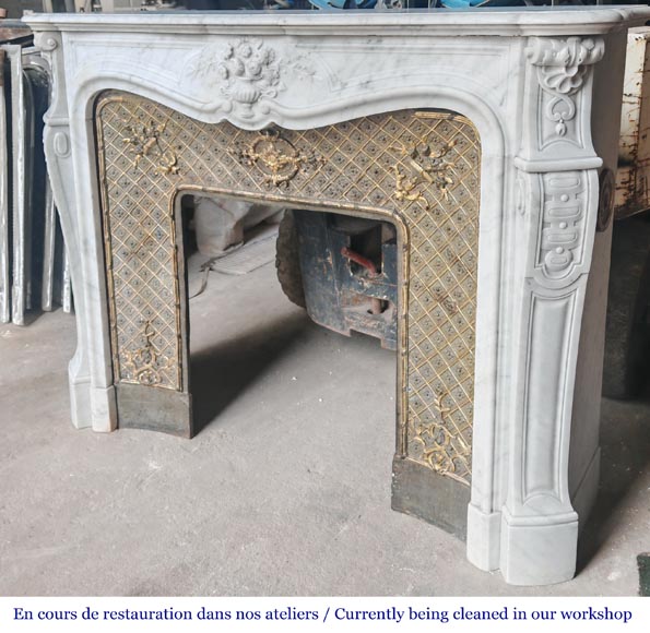 Louis XV style fireplace in Carrara marble, decorated with a vase of flowers-9