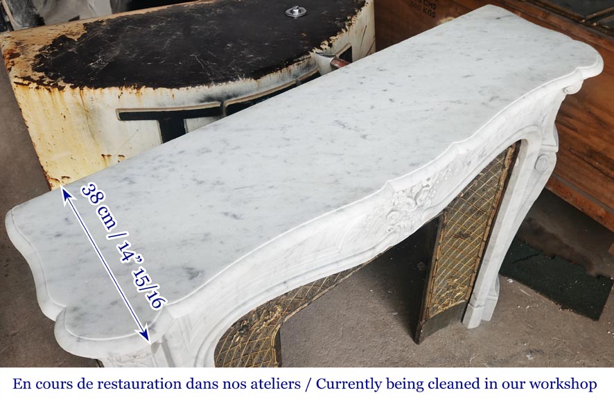 Louis XV style fireplace in Carrara marble, decorated with a vase of flowers-13