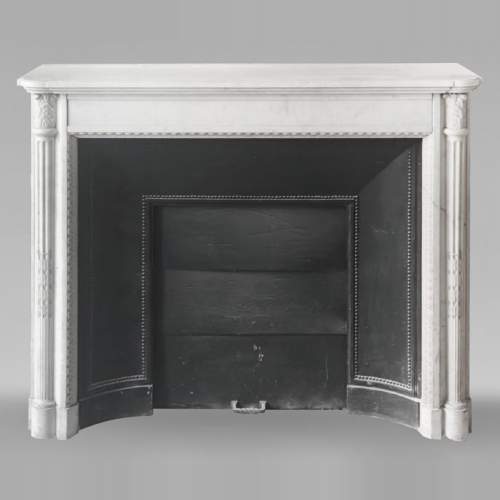 Louis XVI style fireplace in Conne marble, with slender fluted columns