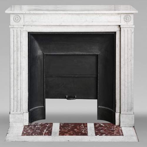 Louis XVI style fireplace with stylized daisies, in Carrara marble