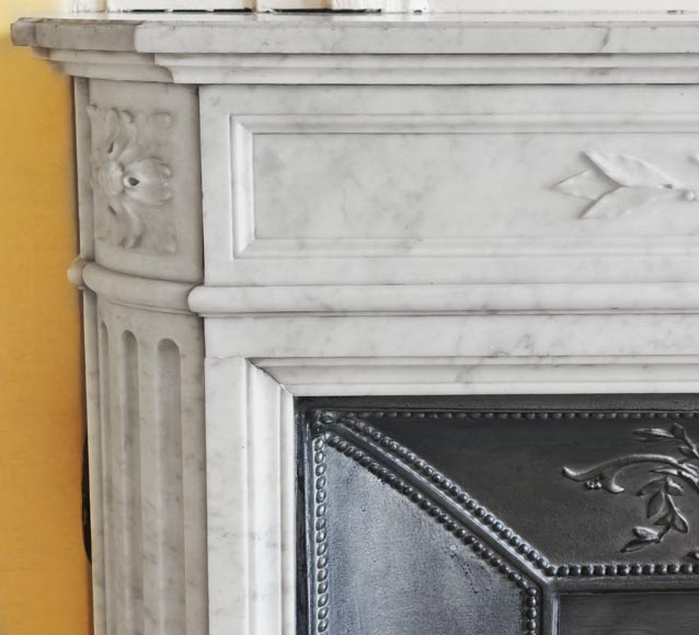 Louis XVI style fireplace with rounded corners and decorated with a laurel wreath, in Carrara marble-5