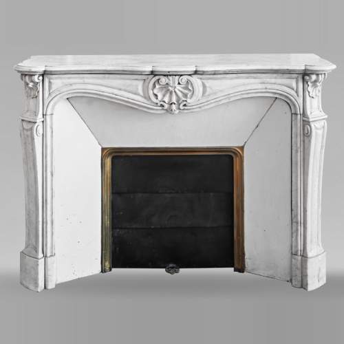 Louis XV style fireplace in Carrara marble decorated with a shell