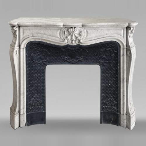 Louis XV style fireplace decorated with a shell, in Carrara marble