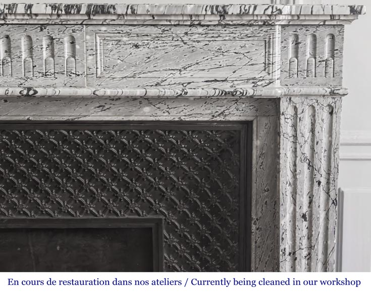  Louis XVI-style fireplace in blue fleuri marble, featuring fluted decoration-5