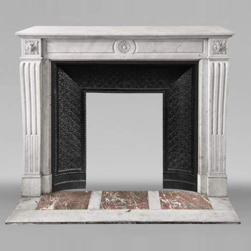 Louis XVI style fireplace in Carrara marble, decorated with a flower