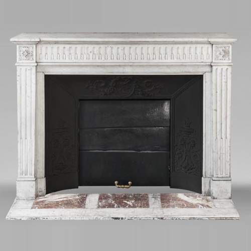  Louis XVI style Carrara marble fireplace decorated with a fluted frieze