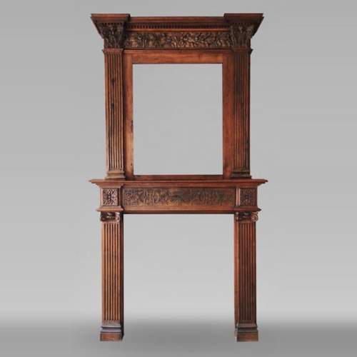 Louis XVI style oak fireplace, decorated with an oak-leaf frieze and surmounted by its oak overmantel