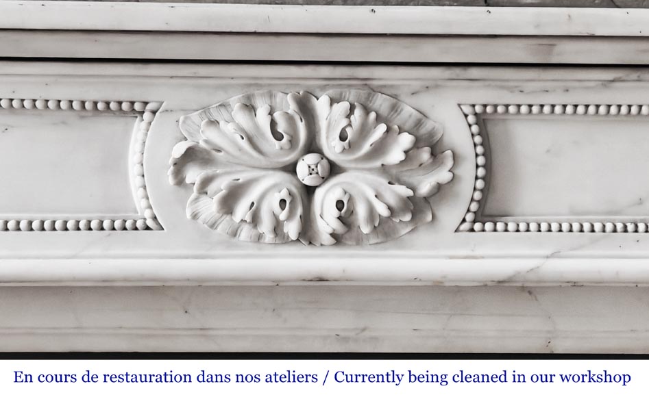 Louis XVI-style statuary marble fireplace featuring acanthus leaf and bead-and-reel motifs Louis XVI-style statuary marble fireplace featuring acanthus leaf and bead-and-reel motifs-1