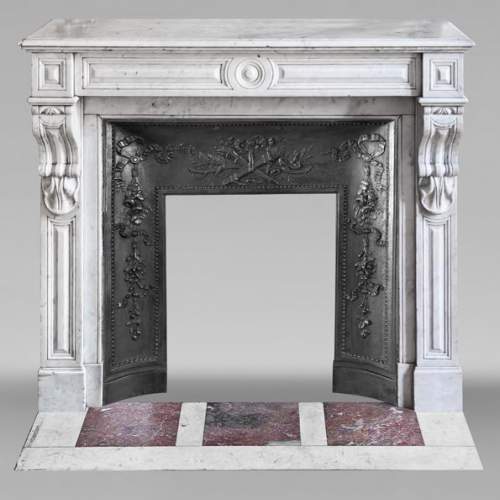 Carrara marble fireplace in the Napoleon III style, featuring water-leaf ornamentation