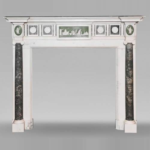 Victorian-style fireplace in statuary marble, featuring Ionic half-columns and a Wedgwood-style medallion decoration