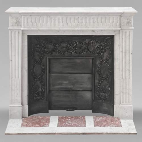Louis XVI-style Carrara marble fireplace with a fluted frieze