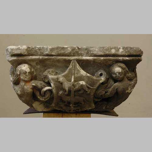 Gothic stone capital with coat of arms