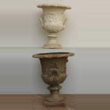 Pair of antique lead vases from the 19th century with putti
